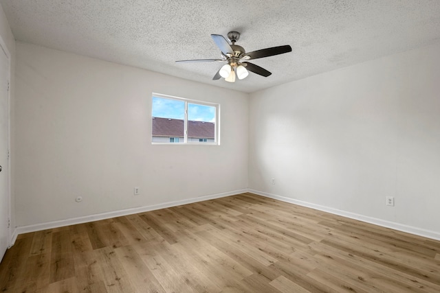 unfurnished room featuring ceiling fan, a textured ceiling, and light hardwood / wood-style flooring