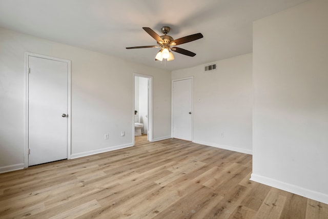 spare room featuring light wood-type flooring and ceiling fan