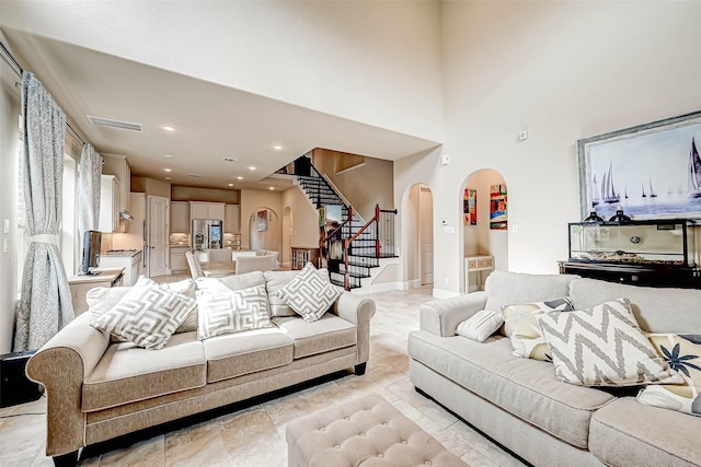 living room featuring a high ceiling