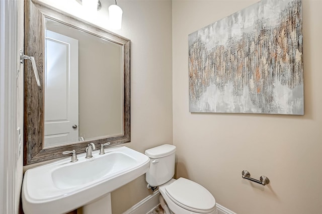 bathroom with toilet and sink