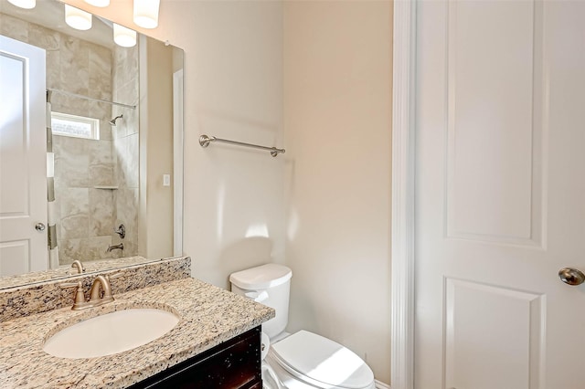 full bathroom with vanity, toilet, and tiled shower / bath