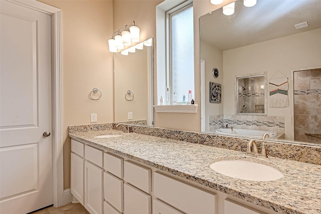 bathroom with a wealth of natural light, vanity, and shower with separate bathtub