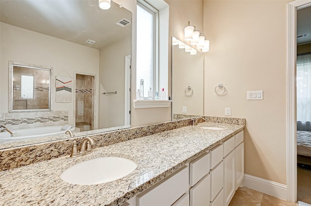 bathroom with tile patterned floors, vanity, plenty of natural light, and plus walk in shower