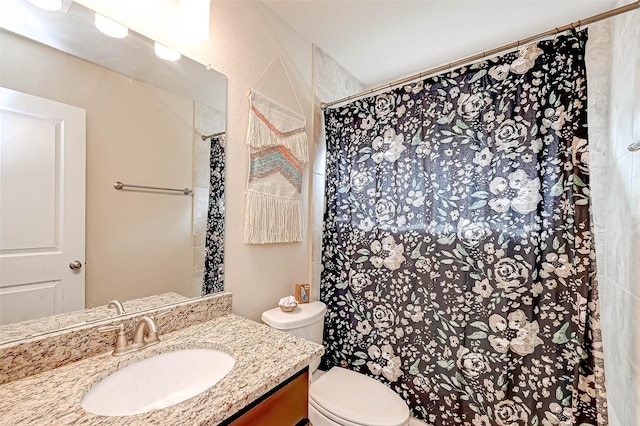 bathroom with a shower with curtain, vanity, and toilet