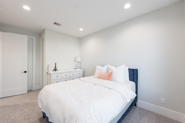 bedroom featuring light carpet