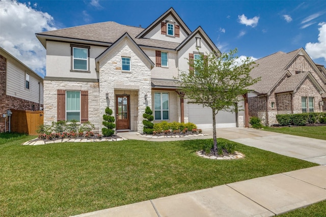 view of front of property featuring a garage and a front yard