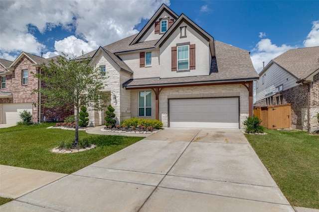 view of front of house featuring driveway, stone siding, roof with shingles, an attached garage, and a front lawn