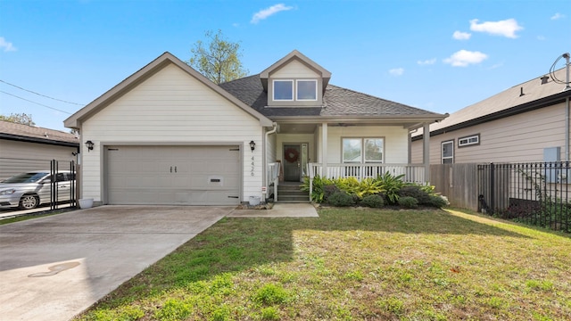 view of front of house featuring a porch, a garage, and a front yard