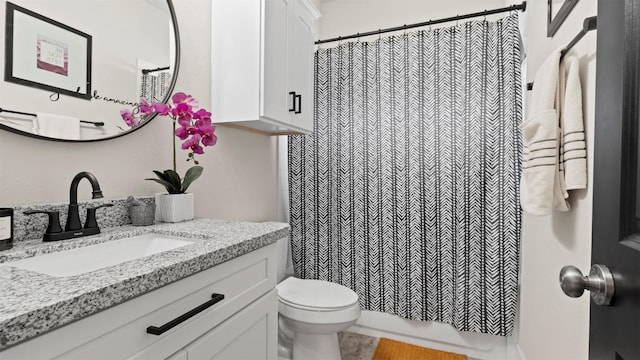 bathroom with a shower with curtain, tile patterned flooring, vanity, and toilet