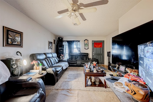 living room featuring ceiling fan and a textured ceiling