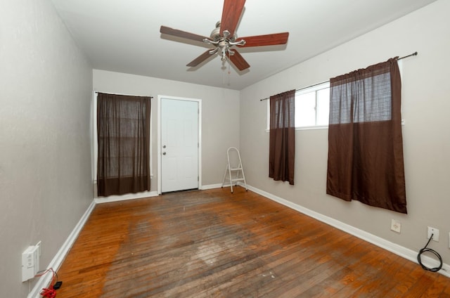 empty room featuring dark hardwood / wood-style floors and ceiling fan