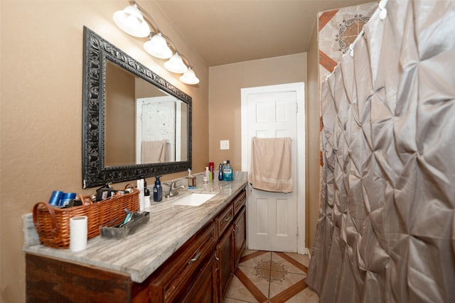 bathroom with tile patterned flooring, vanity, and curtained shower