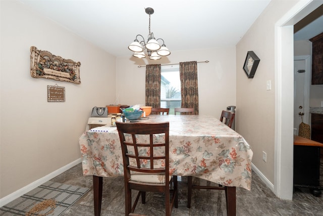 dining room featuring a notable chandelier