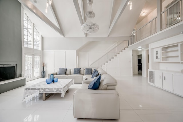 tiled living room featuring french doors, built in features, high vaulted ceiling, beamed ceiling, and a notable chandelier