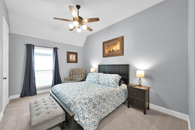 carpeted bedroom featuring ceiling fan and lofted ceiling