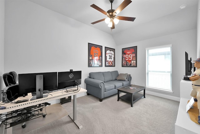 carpeted living room featuring ceiling fan and vaulted ceiling