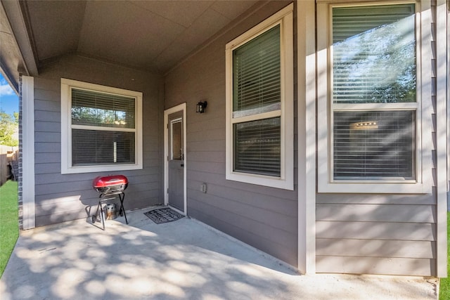 property entrance featuring a patio