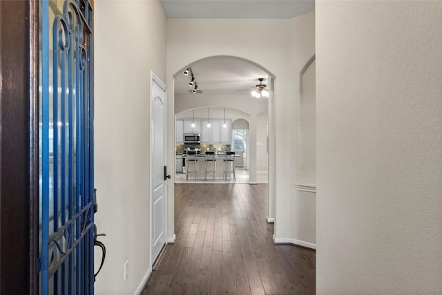 entrance foyer with dark hardwood / wood-style flooring and ceiling fan