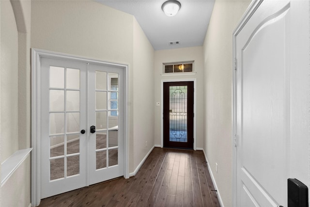 doorway featuring dark hardwood / wood-style flooring and french doors