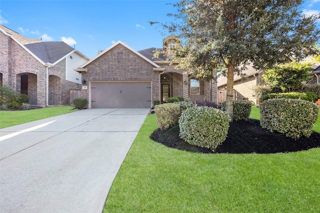 view of front facade with a front yard and a garage