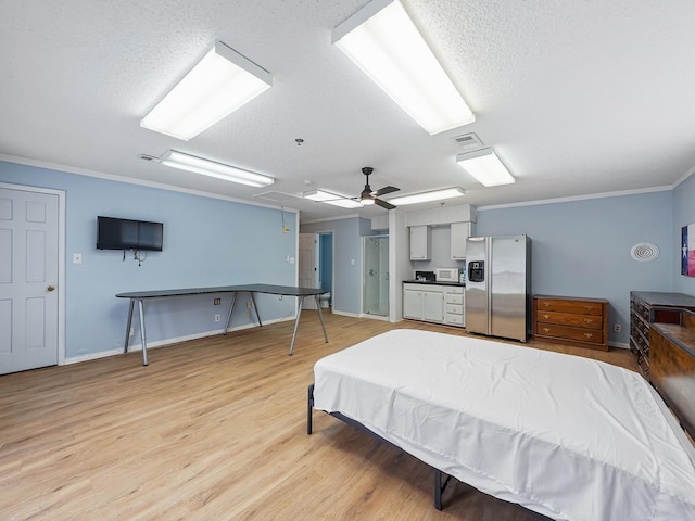 bedroom featuring crown molding, ceiling fan, light wood-type flooring, a textured ceiling, and stainless steel fridge with ice dispenser