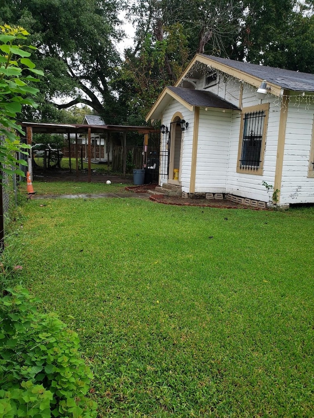 view of yard featuring a carport