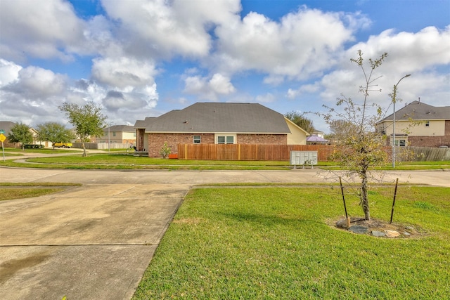 view of property exterior with a yard