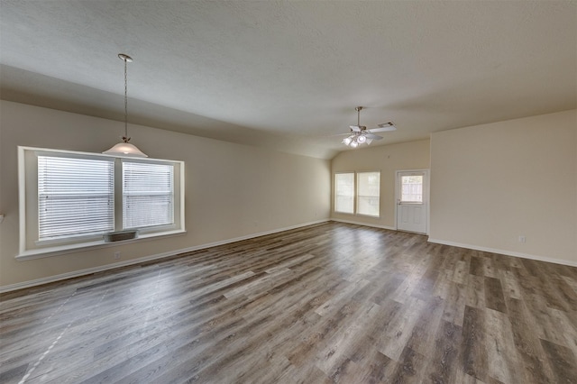 spare room featuring hardwood / wood-style floors, ceiling fan, a textured ceiling, and vaulted ceiling