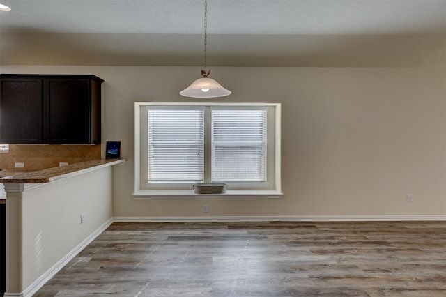 unfurnished dining area featuring light hardwood / wood-style floors