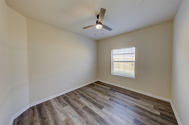 empty room featuring wood-type flooring and ceiling fan