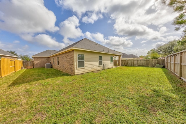 back of property featuring a lawn