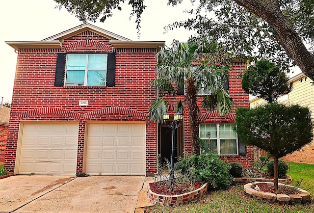 traditional home with a garage, concrete driveway, and brick siding