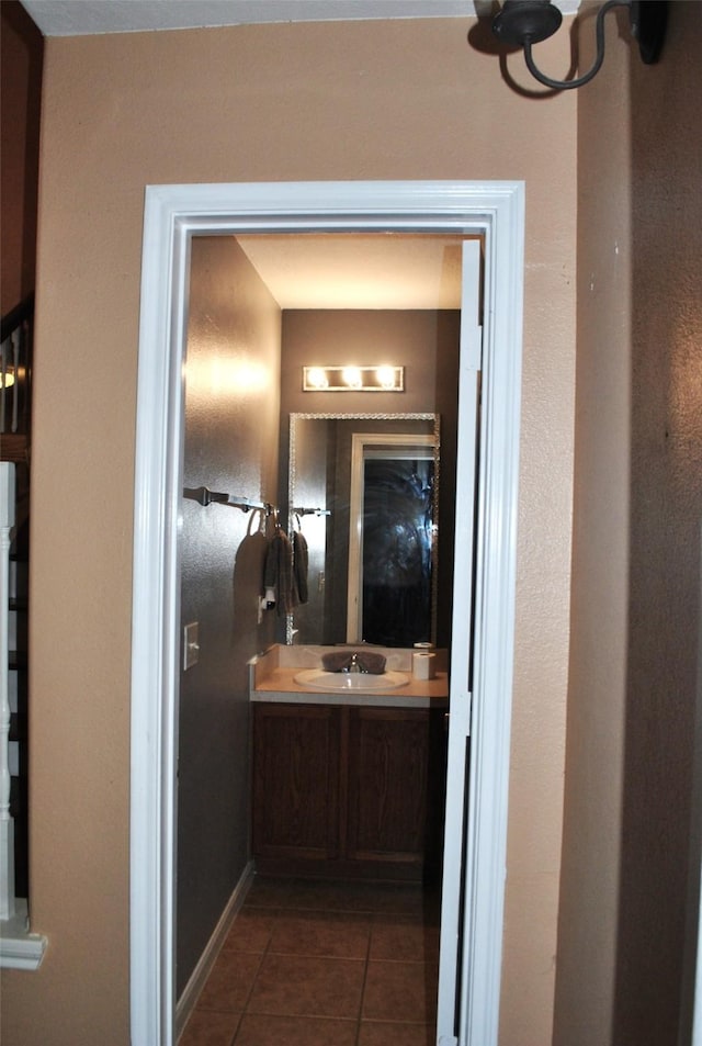 bathroom featuring tile patterned flooring and vanity