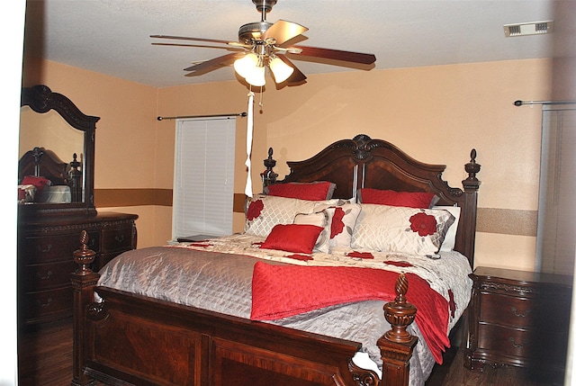 bedroom featuring ceiling fan and dark hardwood / wood-style floors