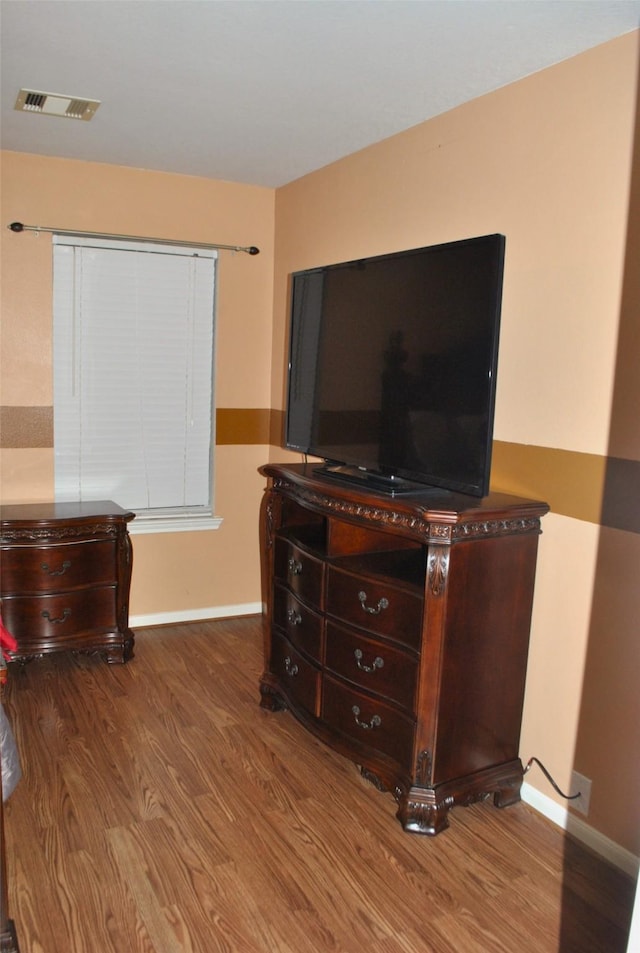 bedroom featuring hardwood / wood-style flooring