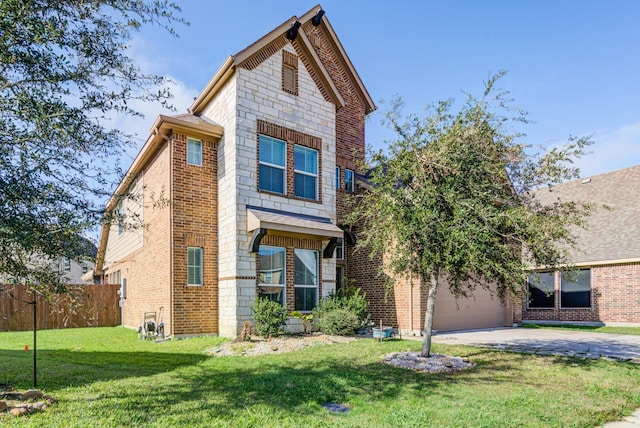 view of front of home with a front yard and a garage