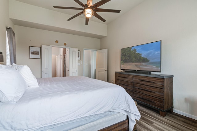 bedroom featuring ceiling fan and dark wood-type flooring