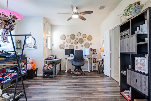 office space featuring dark hardwood / wood-style flooring and ceiling fan