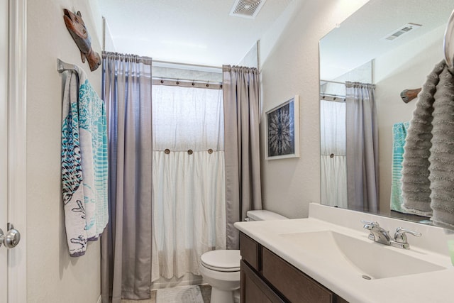 full bathroom featuring vanity, toilet, and shower / tub combo with curtain