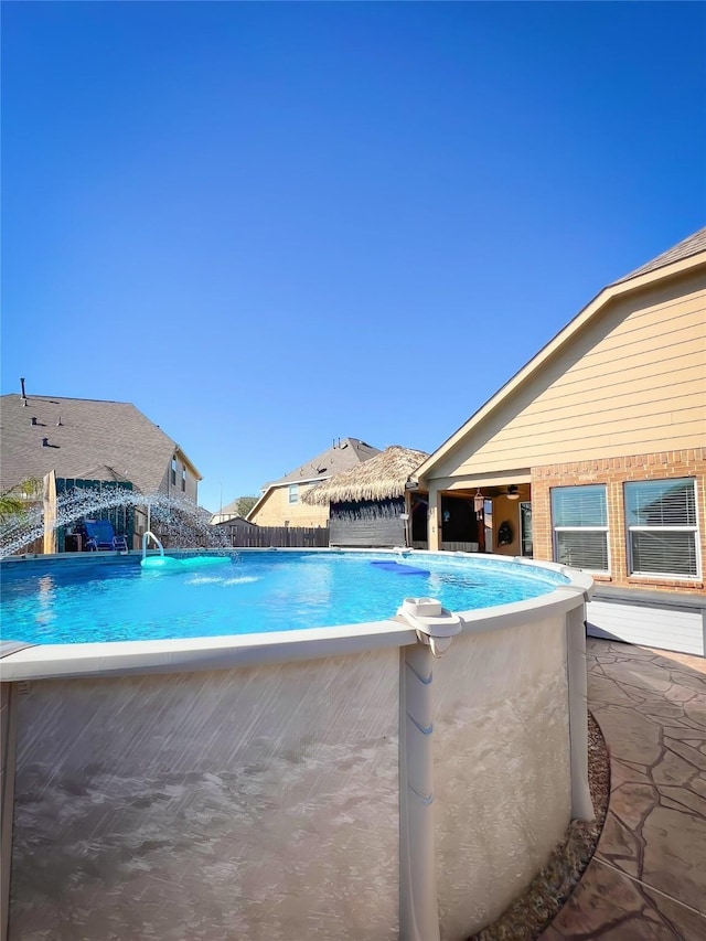 view of swimming pool featuring a patio area