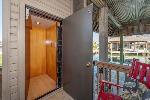 entrance to property with a water view