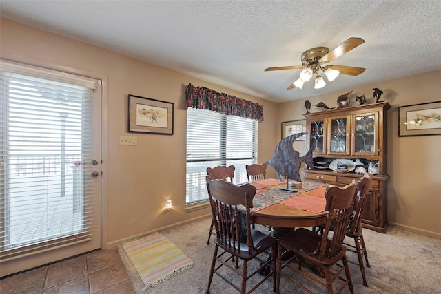 dining room featuring ceiling fan, plenty of natural light, and carpet floors