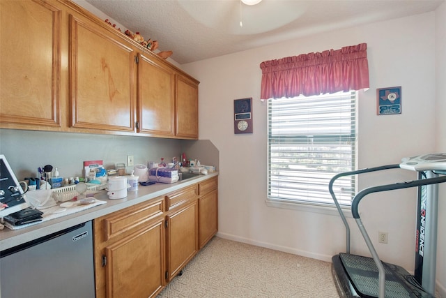 kitchen featuring light carpet, stainless steel fridge, a textured ceiling, and a healthy amount of sunlight