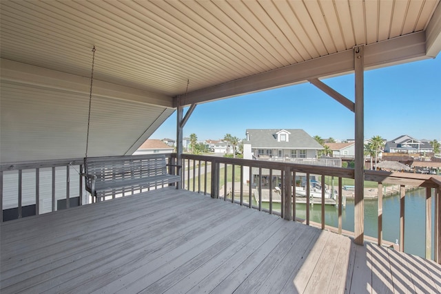 wooden deck featuring a water view