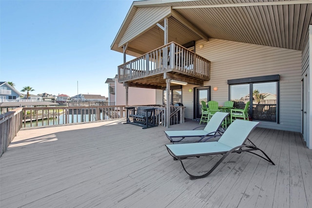 wooden deck with a water view