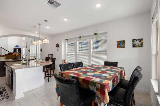 tiled dining area with sink