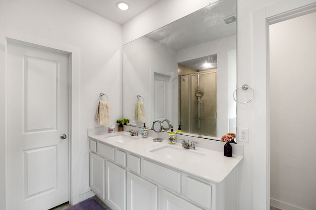 bathroom with vanity and an enclosed shower