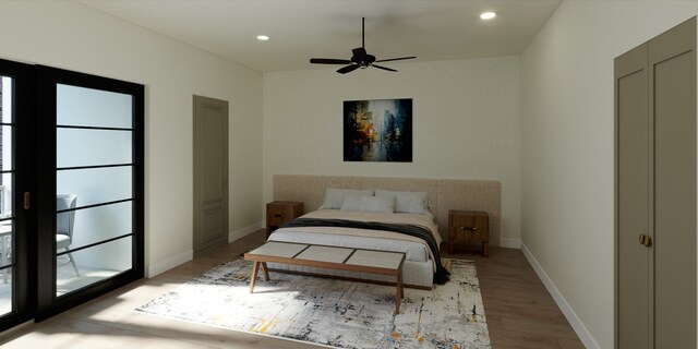 bedroom with ceiling fan and light hardwood / wood-style flooring