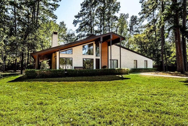 view of side of home featuring a yard