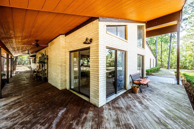 wooden deck featuring ceiling fan